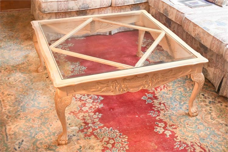 Glass Top Coffee Table With Carved Apron