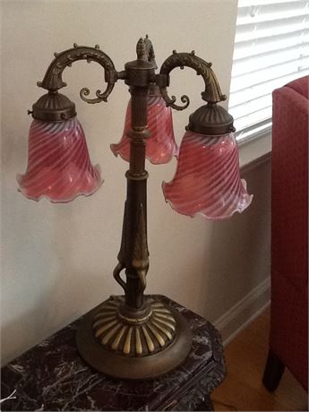 Heavy brass lamp with cranberry glass globes (3)