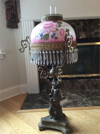 Ornate oil lamp with painted glass shade