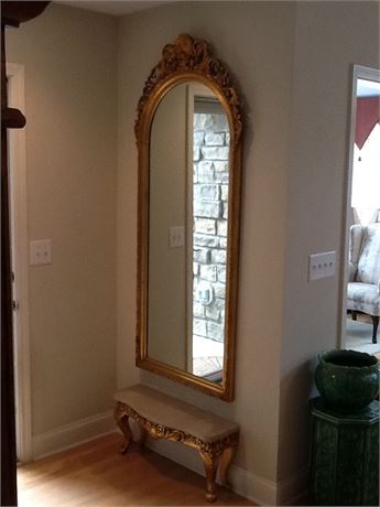 Large vertical wall mirror and marble top bench