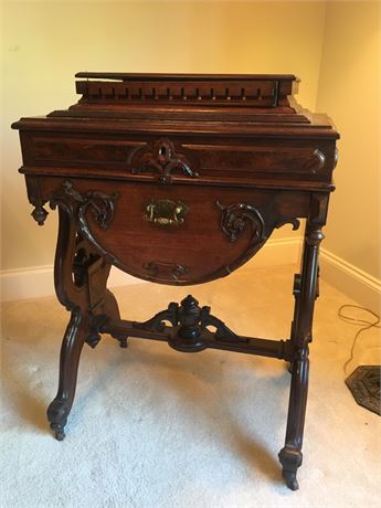 Antique Carved Table with Unique Barrel Drawer