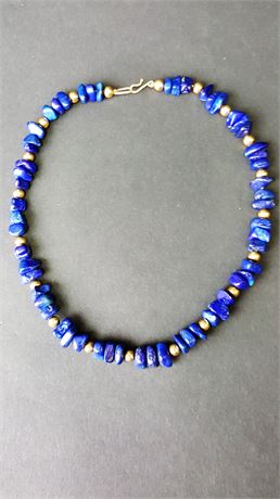 Lot 412. Lapis and Gold Bead Necklace