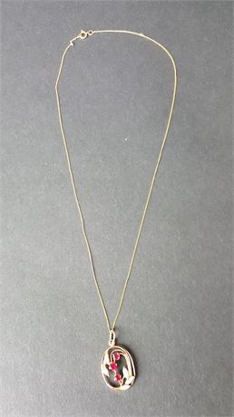 Lot 413. 14 Carat Yellow Gold Chain and Pendant