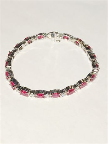 Lot 411. Gold Diamond and Ruby Tennis Bracelet