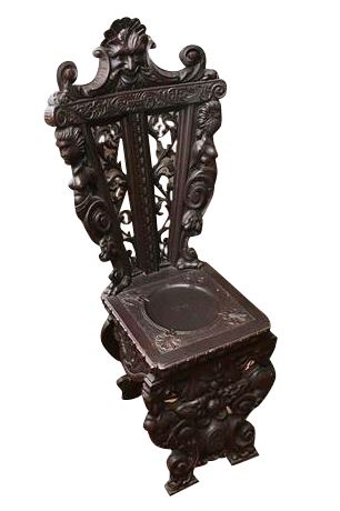 Lot 92. Heavily Carved Chair with Figural Motif