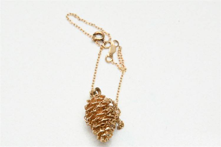 Gold pinecone form pendant on gold chain