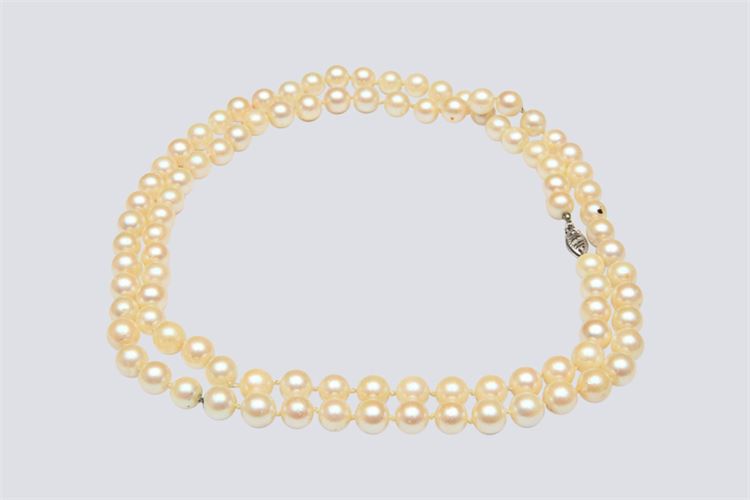 Single Strand Pearl Necklace with White Gold Filigree and Fish Hook Clasp .