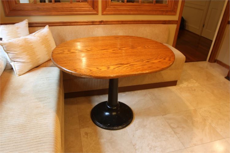 Solid oak oval table with cast iron pedastle