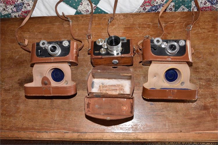 Three (3) Vintage Leather Cased Cameras
