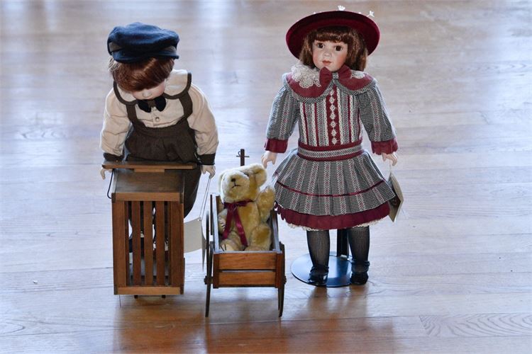 Two Contemporary Bisque Dolls with Teddy Bear Carriage