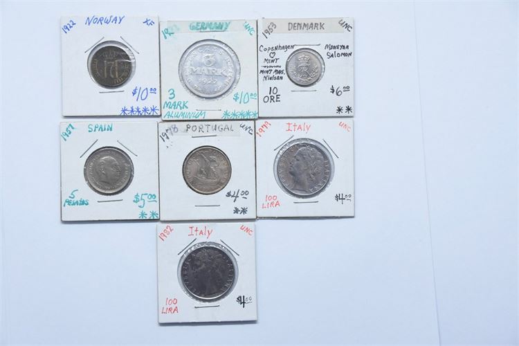 Group of Seven (7) Foreign Coins in Coin Cases