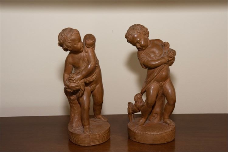 Pair Of Decorative Plaster Putti Statues