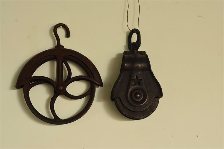 Two (2) Wrought Iron Pullies