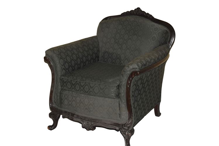 Upholstered Armchair With Carved Details