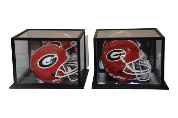 Two (2) Autographed GEORGIA BULLDOGS Helmets With Display Cases