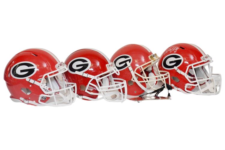 Four (4) GEORGIA BULLDOGS Helmets One Autographed