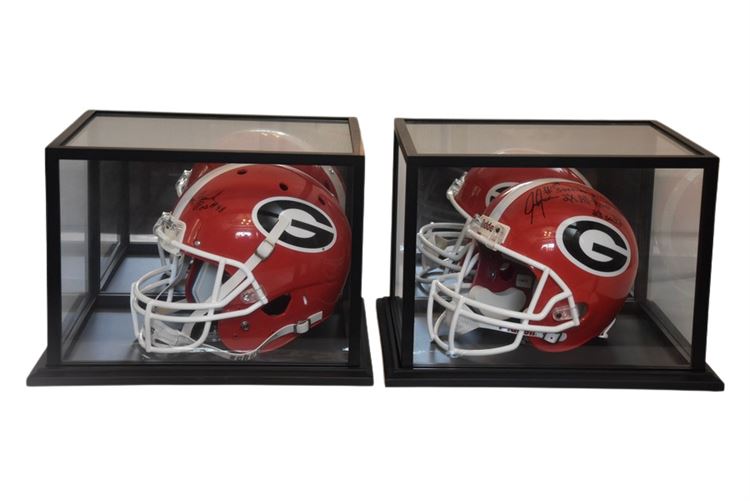 Two (2) Autographed GEORGIA BULLDOGS Helmets With Display Cases