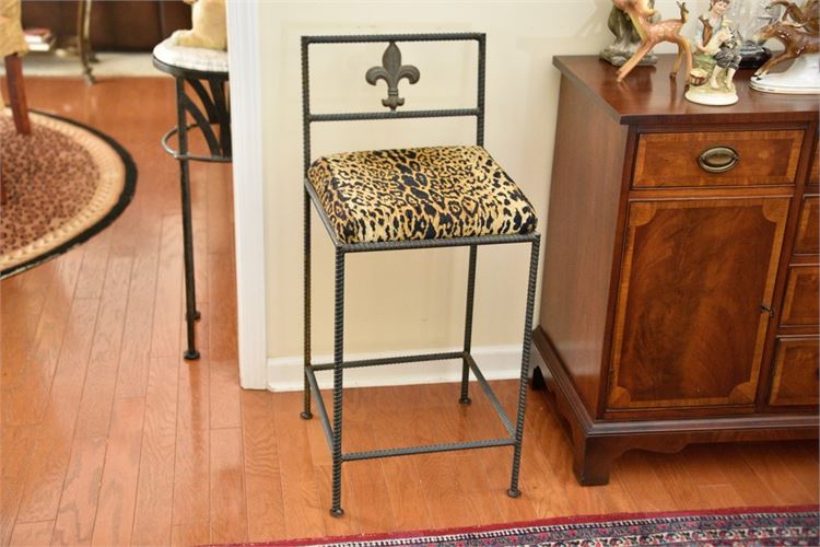 Metal Stool With Leopard Print Upholstered Seat and Fleur De Lis Detail