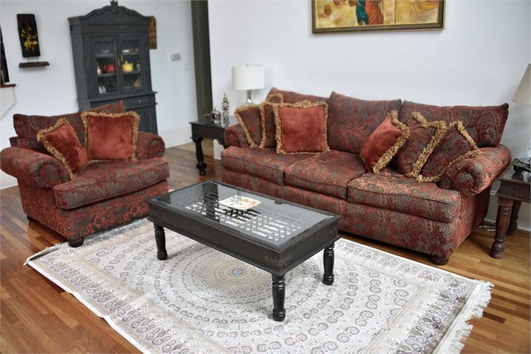 Patterned and Upholstered Sofa and Armchair With Decorative Pillows