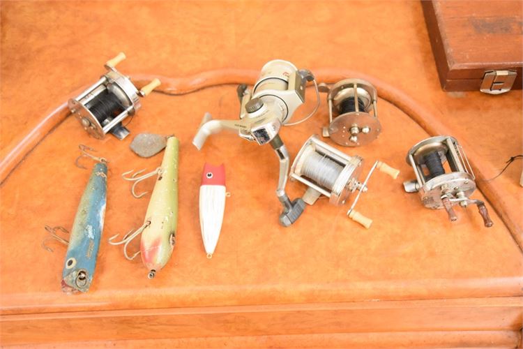 Five vintage bait cast reels of various brands