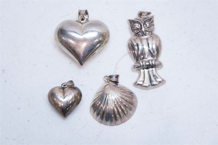 Four (4) Silver Pendants