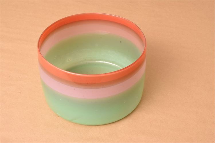 Artisan, handblown glass bowl in graduated bands of pale green, pink, coral