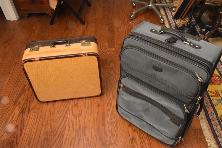 One 27” Pathfinder charcoal suitcase and one vintage 1940’s leather trimmed