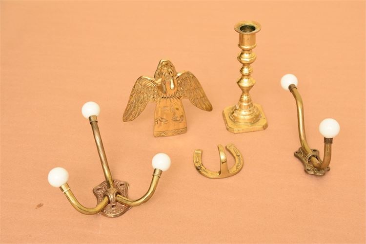 Assortment of brass candlesticks and hooks