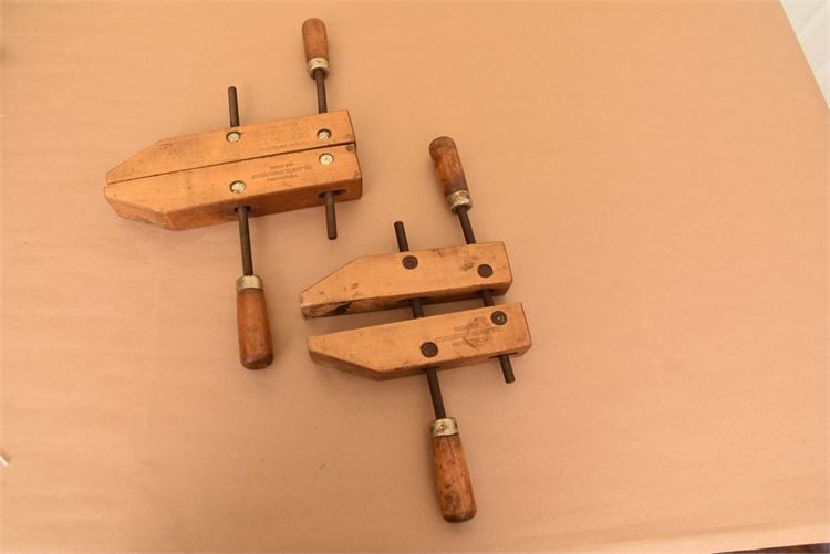 Two adjustable vintage wooden clamps made by the Adjustable Clamp Co. in Chicago