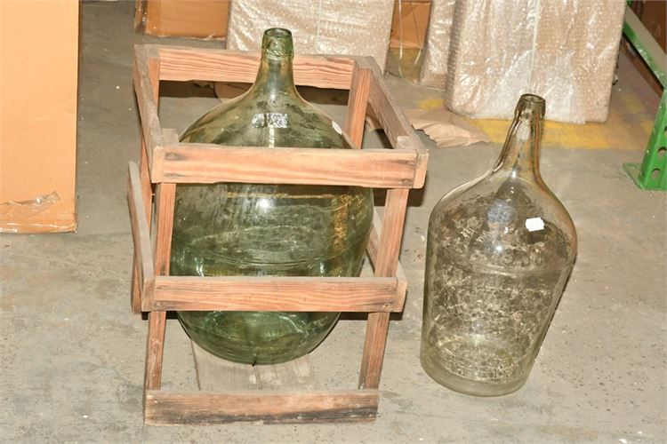 Two (2) Large Glass Jugs One With Wooden Crate