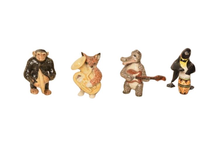 Four (4) Porcelain Animal Musician Figurines