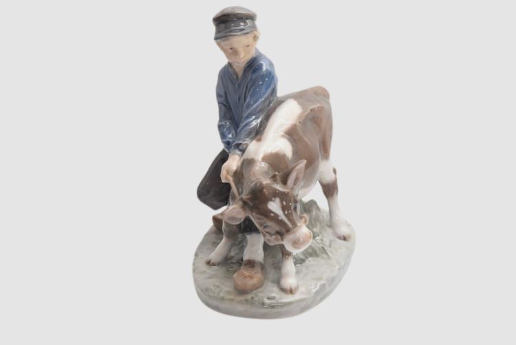 Boy walking to the field with Calf, Royal Copenhagen figurine