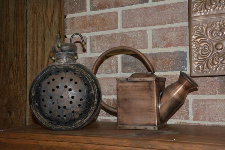 Metal Watering Can and Thing with Holes