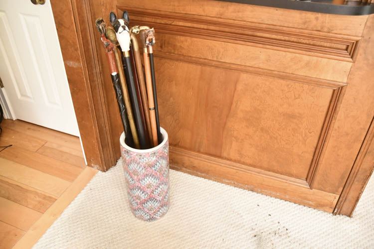 Porcelain Umbrella Stand and Group of Decorative Handle Canes