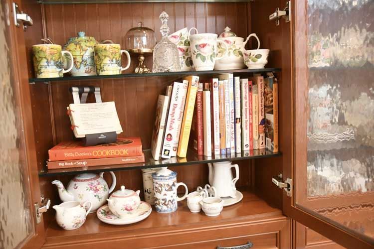 Three Shelves Decorative Porcelains and Cookbooks