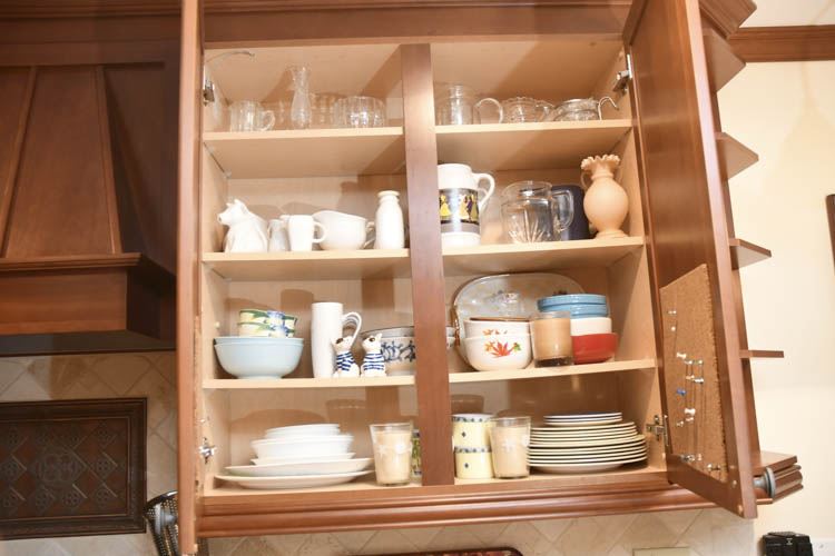 Glass and Porcelain Located in Two Kitchen Cabinets