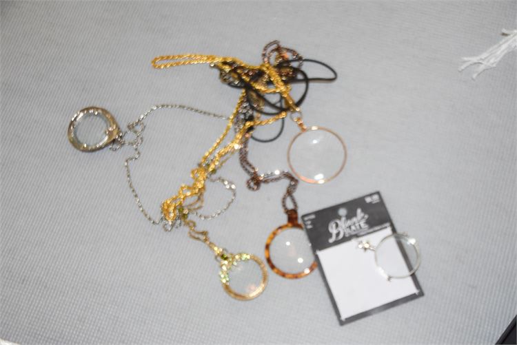 Five Magnifying Glasses on Chains