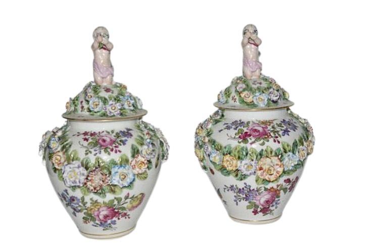 A pair of 19th Century German Porcelain Vases with Figural  Lids