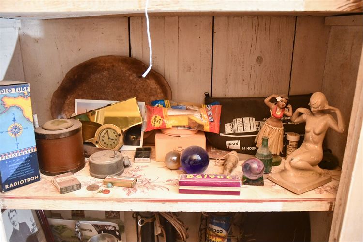 Shelf with Various Items: Figurines, Clock, and Boxes