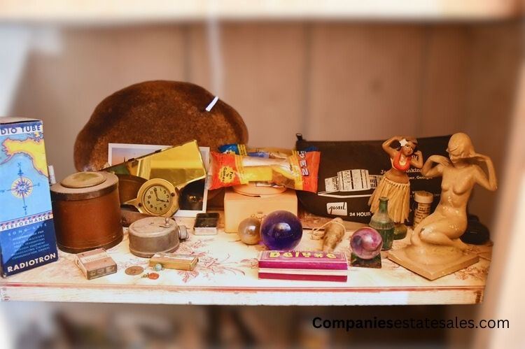 Shelf with Various Items: Figurines, Clock, and Boxes