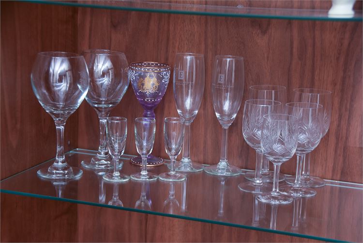 Several wine glasses: Champagne Flutes an Shot Glasses